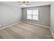 Comfortable bedroom with carpet flooring, ceiling fan, and ample natural light from a window at 509 Riviera Pl, Rock Hill, SC 29730
