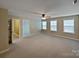 This bedroom features neutral tan walls, and ample natural light at 509 Riviera Pl, Rock Hill, SC 29730