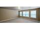 Spacious bonus room featuring neutral carpet, multiple windows for natural light, and ample space at 509 Riviera Pl, Rock Hill, SC 29730