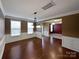 Elegant dining room with hardwood floors, wainscoting, and ample natural light at 509 Riviera Pl, Rock Hill, SC 29730