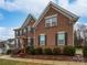 Charming brick two-story home featuring dark shutters, well-kept landscaping, and a welcoming entrance at 509 Riviera Pl, Rock Hill, SC 29730