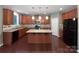 Spacious kitchen with an island, granite countertops, stainless steel appliances, and wood cabinetry at 509 Riviera Pl, Rock Hill, SC 29730