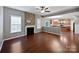 Cozy living room with a stone fireplace, hardwood floors, and an open layout at 509 Riviera Pl, Rock Hill, SC 29730