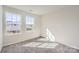 Bright bedroom with two windows showcasing neutral walls, plush carpet, and natural light at 5336 Small St, Catawba, NC 28609