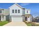 Charming two-story home with a white garage door, classic windows, and a manicured lawn at 5336 Small St, Catawba, NC 28609