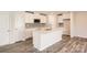 Open-concept kitchen boasting an island, stainless steel microwave, and white cabinets at 5336 Small St, Catawba, NC 28609