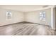 Bright living room featuring wood-look flooring and natural light from two windows at 5336 Small St, Catawba, NC 28609