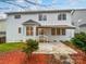 Backyard view of the home featuring a patio, awning, and mature trees at 6409 Chadwell Ct, Fort Mill, SC 29707