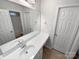 Bright bathroom with a large mirror, vanity and white fixtures at 6409 Chadwell Ct, Fort Mill, SC 29707