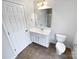 Bathroom featuring a tile floor, white vanity and a large mirror at 6409 Chadwell Ct, Fort Mill, SC 29707