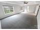 Spacious primary bedroom with plush carpeting, ceiling fan and multiple windows at 6409 Chadwell Ct, Fort Mill, SC 29707