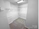 Walk-in closet with wire shelving for maximum storage and organization at 6409 Chadwell Ct, Fort Mill, SC 29707