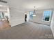 Bright dining room featuring updated lighting, neutral paint and plush gray carpeting at 6409 Chadwell Ct, Fort Mill, SC 29707