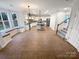 Open concept kitchen with white cabinets, a large island and stainless steel appliances at 6409 Chadwell Ct, Fort Mill, SC 29707