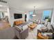 Cozy living room features neutral tones, natural light, and comfortable seating at 6409 Chadwell Ct, Fort Mill, SC 29707