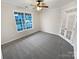 Bright, carpeted room with french doors and large window offering a lot of natural light at 6409 Chadwell Ct, Fort Mill, SC 29707
