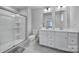 Modern bathroom with a glass shower, double vanity, and gray accents at 730 Bonica Ct, Lancaster, SC 29720