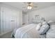 Neutral bedroom with a striped bedspread, dresser, and large windows at 730 Bonica Ct, Lancaster, SC 29720