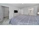 Bright bedroom with a striped bedspread, dresser, and closet at 730 Bonica Ct, Lancaster, SC 29720