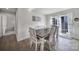Bright dining room with a rustic wood table, stylish chairs, and a view to the outside at 730 Bonica Ct, Lancaster, SC 29720