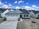 Charming single-story home with a two car garage, craftsman details, and a well manicured front yard at 730 Bonica Ct, Lancaster, SC 29720