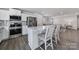 Modern kitchen with stainless steel appliances, a center island, and seamless flow to the living room at 730 Bonica Ct, Lancaster, SC 29720