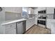 Contemporary kitchen featuring stainless steel appliances, white cabinets, and quartz countertops at 730 Bonica Ct, Lancaster, SC 29720