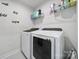 Modern laundry room features washer, dryer and storage at 730 Bonica Ct, Lancaster, SC 29720