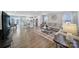 Inviting living room with hardwood floors, comfortable seating, and seamless flow into the modern kitchen at 730 Bonica Ct, Lancaster, SC 29720