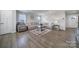 Bright living room featuring hardwood floors, neutral decor, and an open layout at 730 Bonica Ct, Lancaster, SC 29720