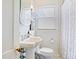 Bathroom with a bright window, pedestal sink, and a combination shower and tub at 734 Poindexter Dr, Charlotte, NC 28209