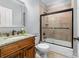 Bathroom featuring a single sink vanity and a tile surround shower and tub combination at 7674 Bermuda Hills Ln, Denver, NC 28037