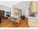 Bright, open kitchen with a fireplace and bar stool seating area at 7674 Bermuda Hills Ln, Denver, NC 28037