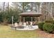 Relaxing outdoor gazebo with firepit and comfortable seating area at 7674 Bermuda Hills Ln, Denver, NC 28037