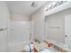 Bathroom featuring tub with shower, granite counter top and vanity with mirror at 8007 Shadbrush Ct, Charlotte, NC 28215