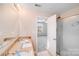 Bright bathroom with double sinks, granite counters, and glass enclosed shower stall at 8007 Shadbrush Ct, Charlotte, NC 28215