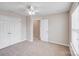 Bedroom featuring neutral paint, carpeted floor, a ceiling fan, and closet at 8007 Shadbrush Ct, Charlotte, NC 28215