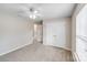 Bedroom featuring neutral paint, closet, ceiling fan, window, and carpeted floor at 8007 Shadbrush Ct, Charlotte, NC 28215