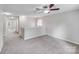 Upstairs hallway with neutral paint and carpeted floor that leads to the bedrooms at 8007 Shadbrush Ct, Charlotte, NC 28215