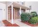 Home exterior showcasing stone accents, covered porch, and well-maintained landscaping at 8007 Shadbrush Ct, Charlotte, NC 28215