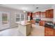 Well-lit kitchen boasts stainless appliances, an island, and ample cabinet space at 8007 Shadbrush Ct, Charlotte, NC 28215