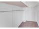 Walk-in closet featuring carpeted floor and wire shelving for optimal storage space at 8007 Shadbrush Ct, Charlotte, NC 28215