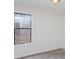 Bedroom featuring updated flooring and a large window providing natural light at 8104 Tamalpais Ct, Charlotte, NC 28215