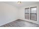Bright bedroom with hardwood floors and a large window providing natural light at 8104 Tamalpais Ct, Charlotte, NC 28215