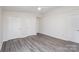 Bedroom featuring updated flooring and closet space at 8104 Tamalpais Ct, Charlotte, NC 28215