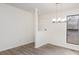 Bright dining room featuring modern chandelier and updated flooring at 8104 Tamalpais Ct, Charlotte, NC 28215