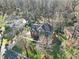 An aerial view of a residential neighborhood with mature trees and well-maintained homes at 907 Thorn Ridge Ln, Lake Wylie, SC 29710