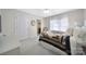 Bright bedroom featuring a ceiling fan, patterned quilt, and access to an ensuite bathroom at 907 Thorn Ridge Ln, Lake Wylie, SC 29710
