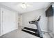Neutral bedroom with a ceiling fan, a TV, and a treadmill at 907 Thorn Ridge Ln, Lake Wylie, SC 29710