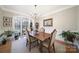 Bright dining room featuring hardwood floors, wainscoting, and a large window at 907 Thorn Ridge Ln, Lake Wylie, SC 29710